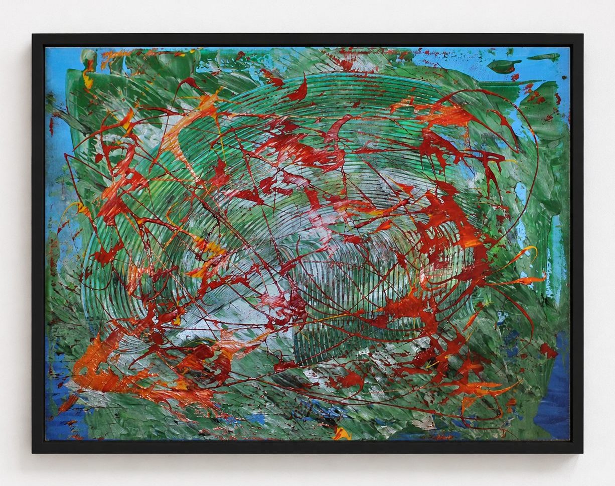 Green and red strokes over blue, in a pale oak frame