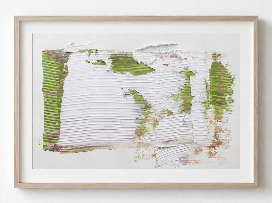 A thickly troweled white work with green edges, in a pale frame