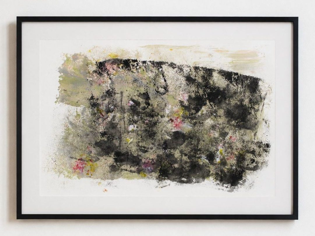 A black and olive mossy work with pink flecks, in a black frame