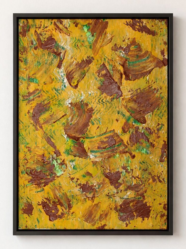 A yellow canvas with brown patches and green flecks, in a black frame