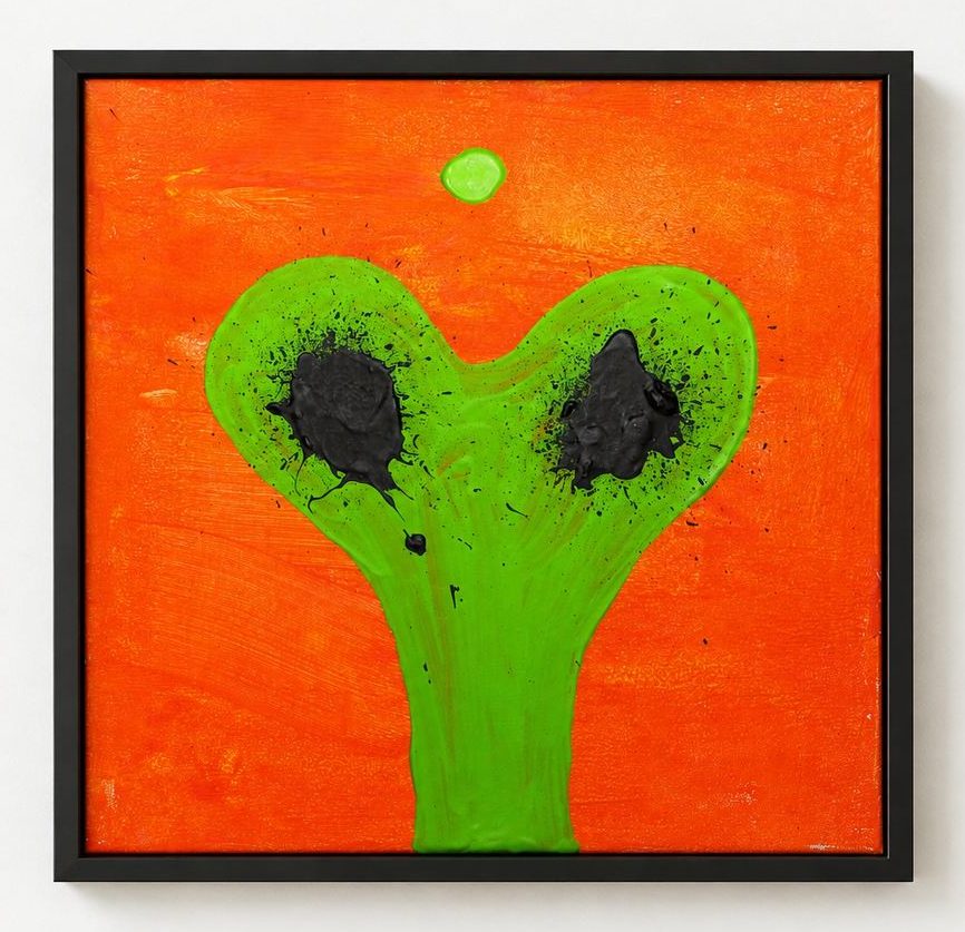 An orange canvas with a green Y-shape and two black blots, in a black frame