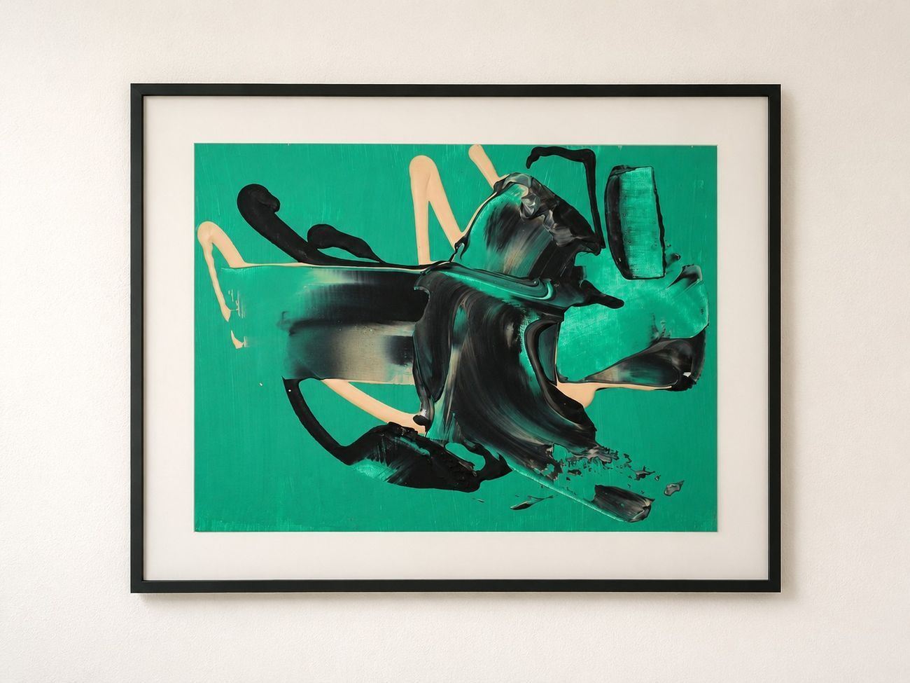 An emerald green work on paper with black and peach strokes, in a black frame