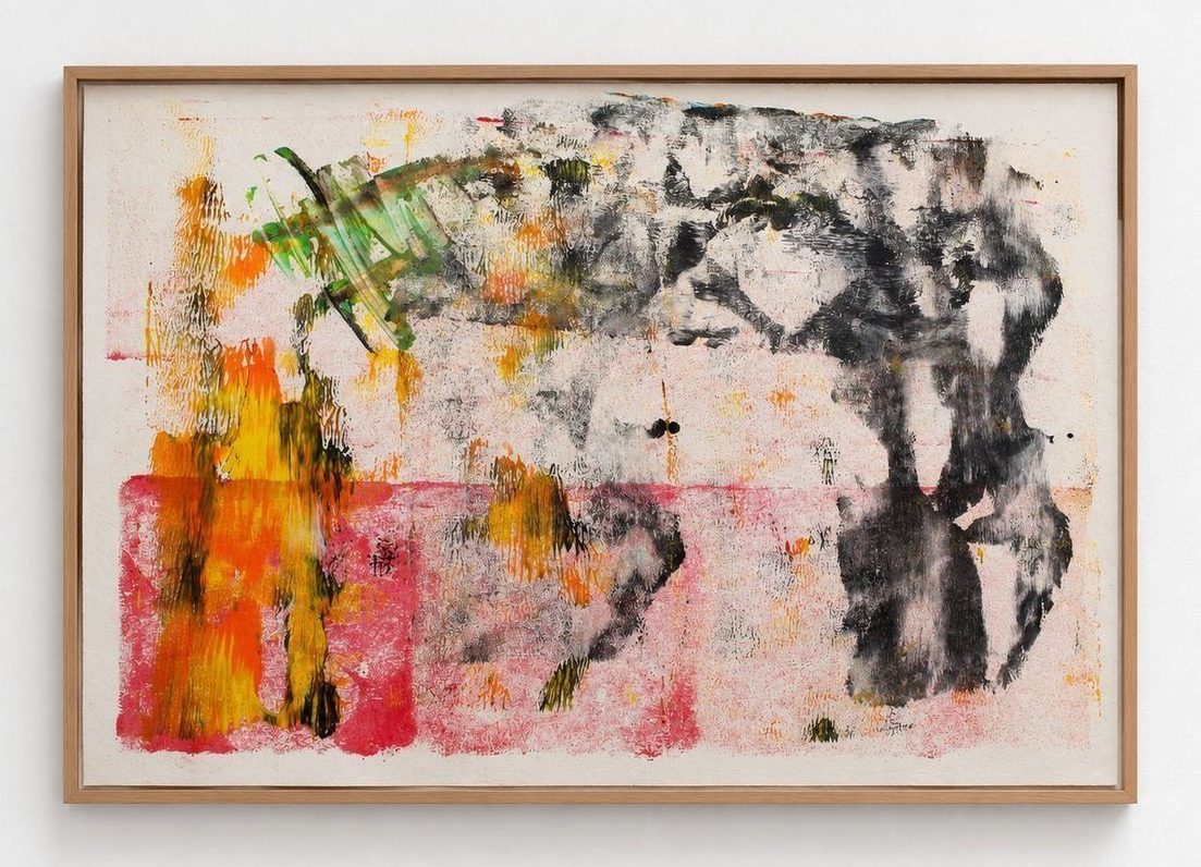 A pink and orange work on paper with black and green marks, in an oak frame