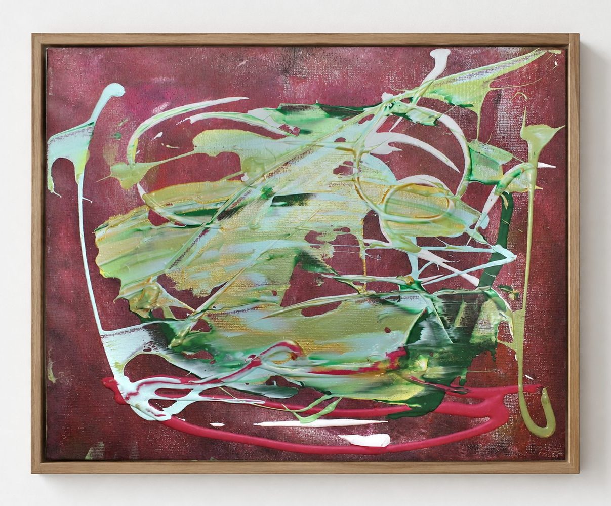 Green and white loops on a deep red ground, in a pale oak frame
