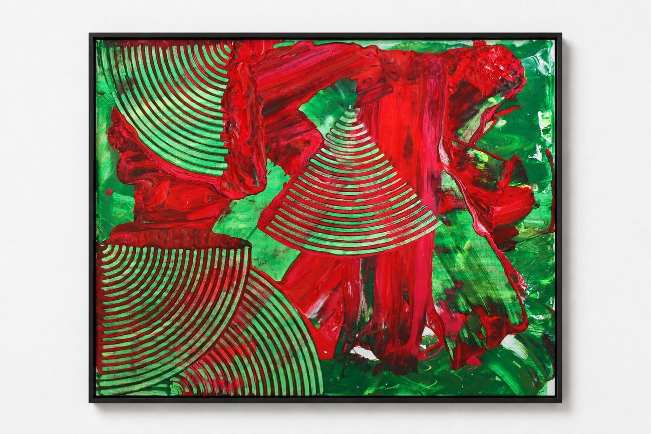 A green canvas with red poured strokes and combed arcs, in a black frame