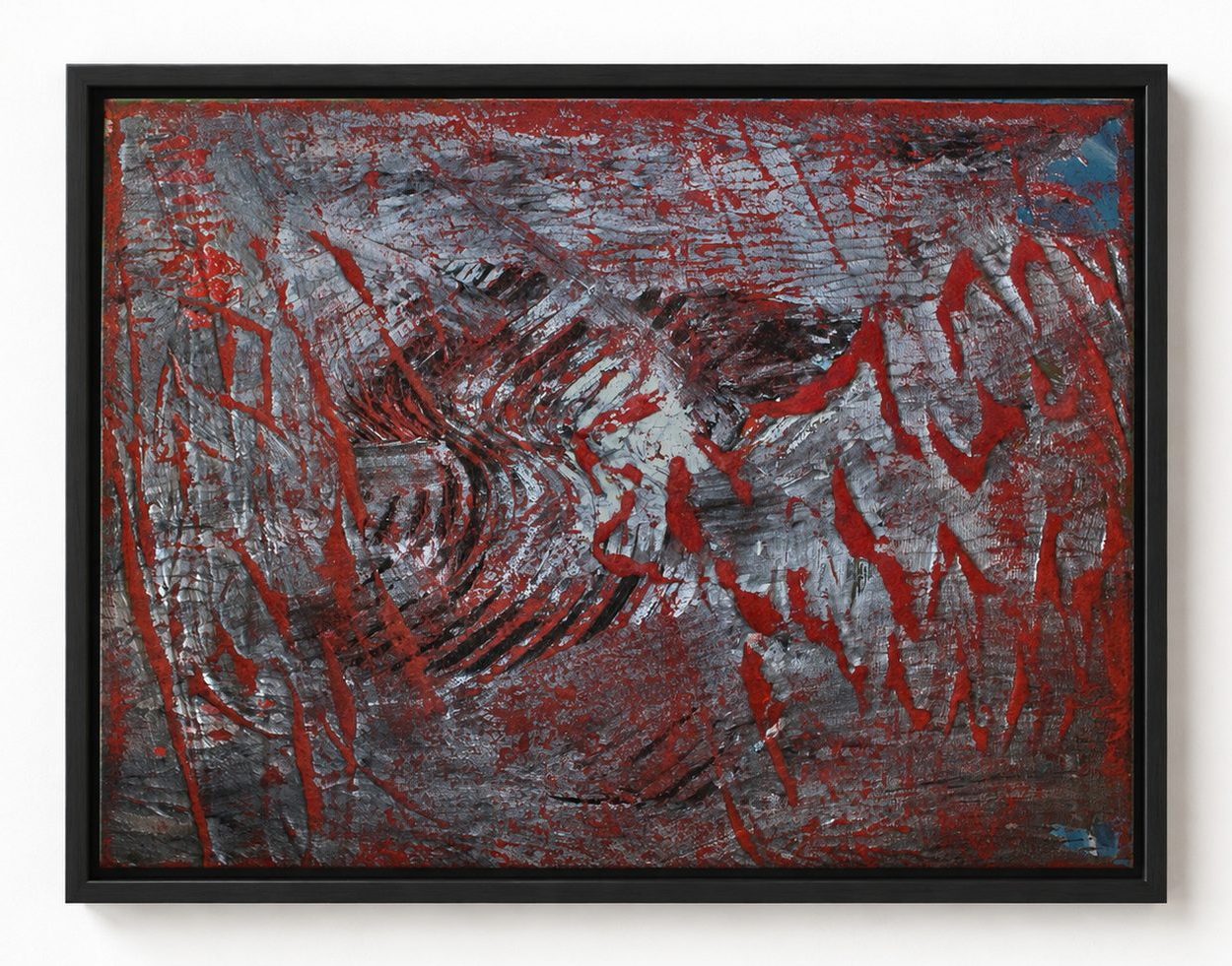 Red scratched marks on a dark ground, in a black frame