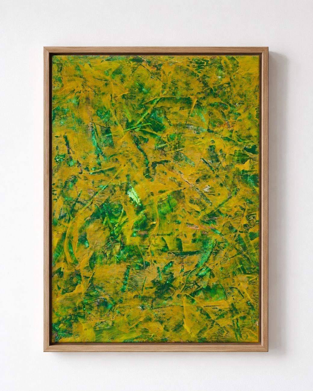A yellow and green textured canvas, in an oak frame