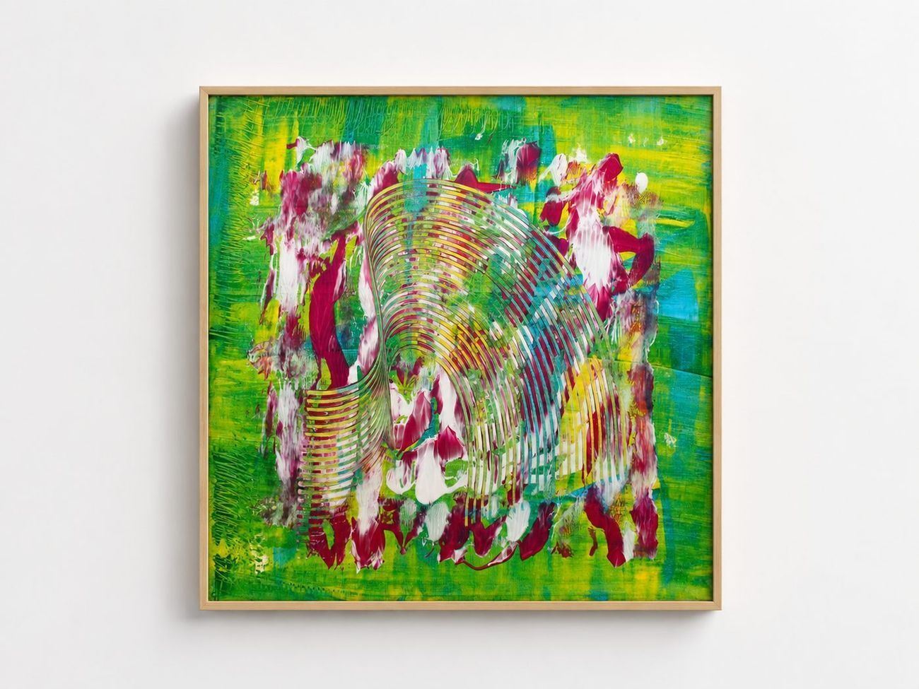 A green and yellow canvas with magenta rings, in an oak frame