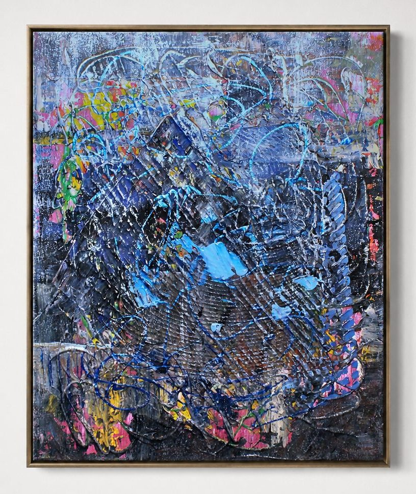 Blue and pink flecks over a dark ground, in a pale frame