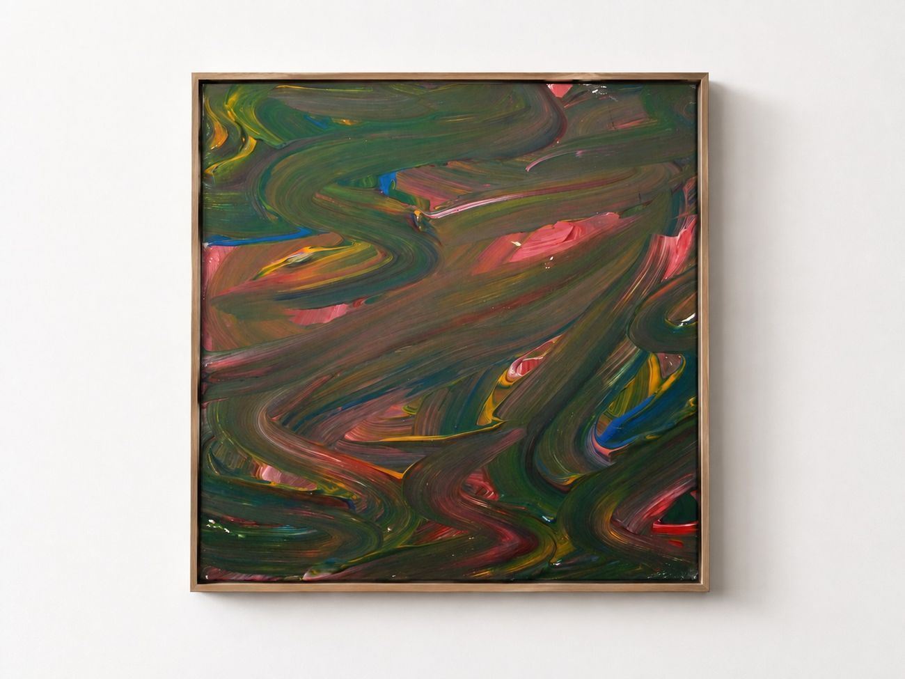 A dark canvas of swirling green, pink and yellow, in an oak frame