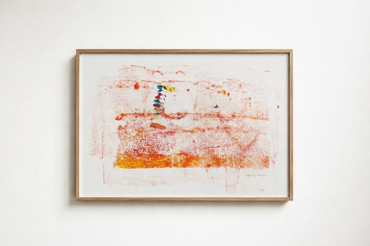 A faint orange and red wash on paper, in an oak frame