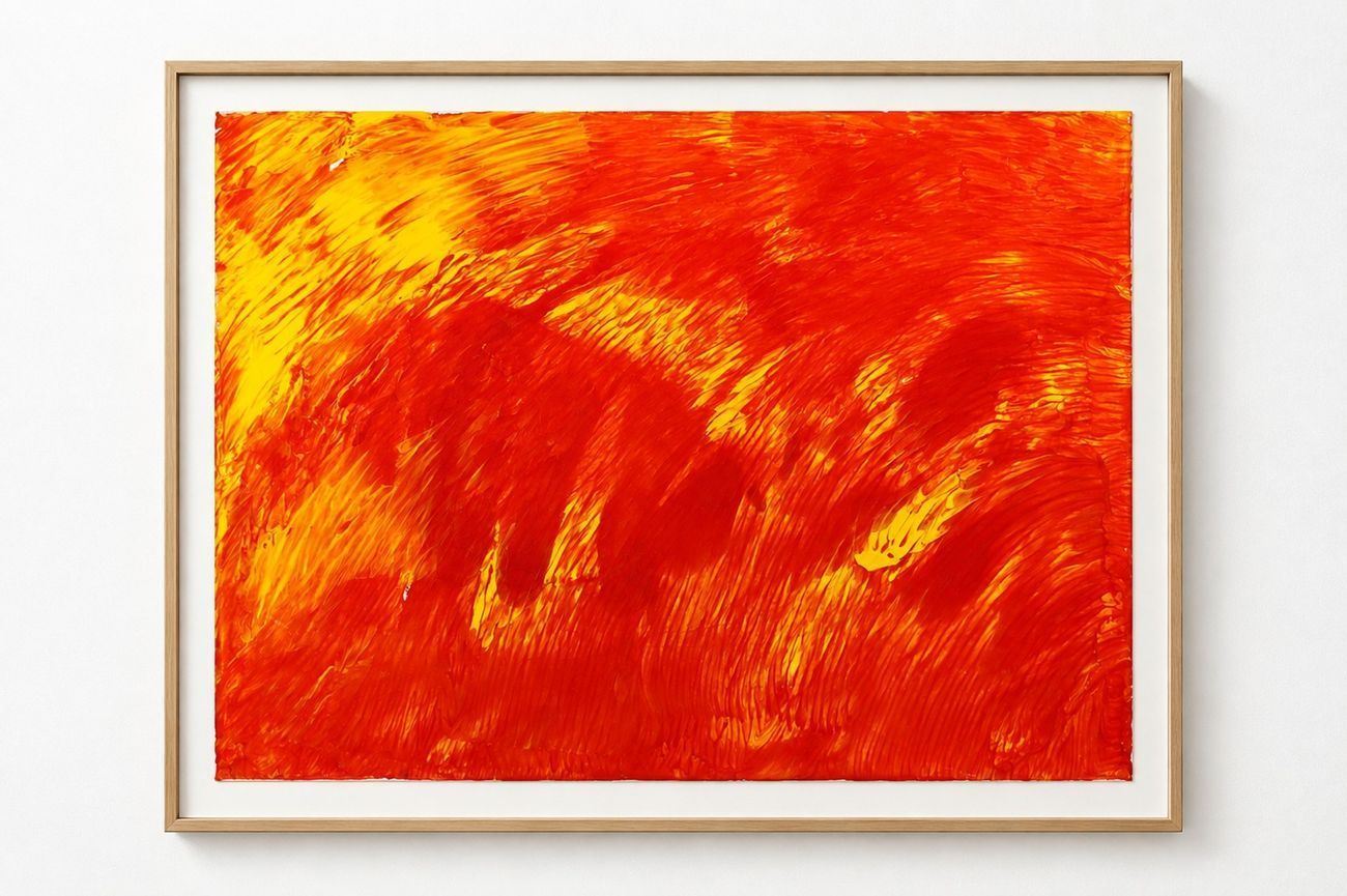 An orange and red work on paper brushed into a flame, in an oak frame