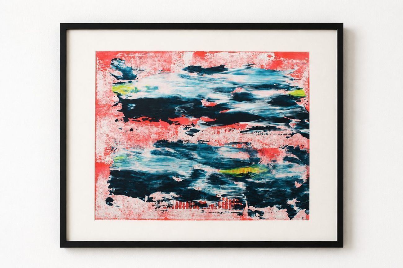 A red and navy wave painting, in a black frame